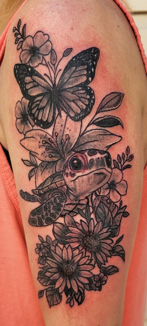 Butterfly and floral shoulder piece by Billy at SK-Tattoo1 in Meridian, Mississippi
