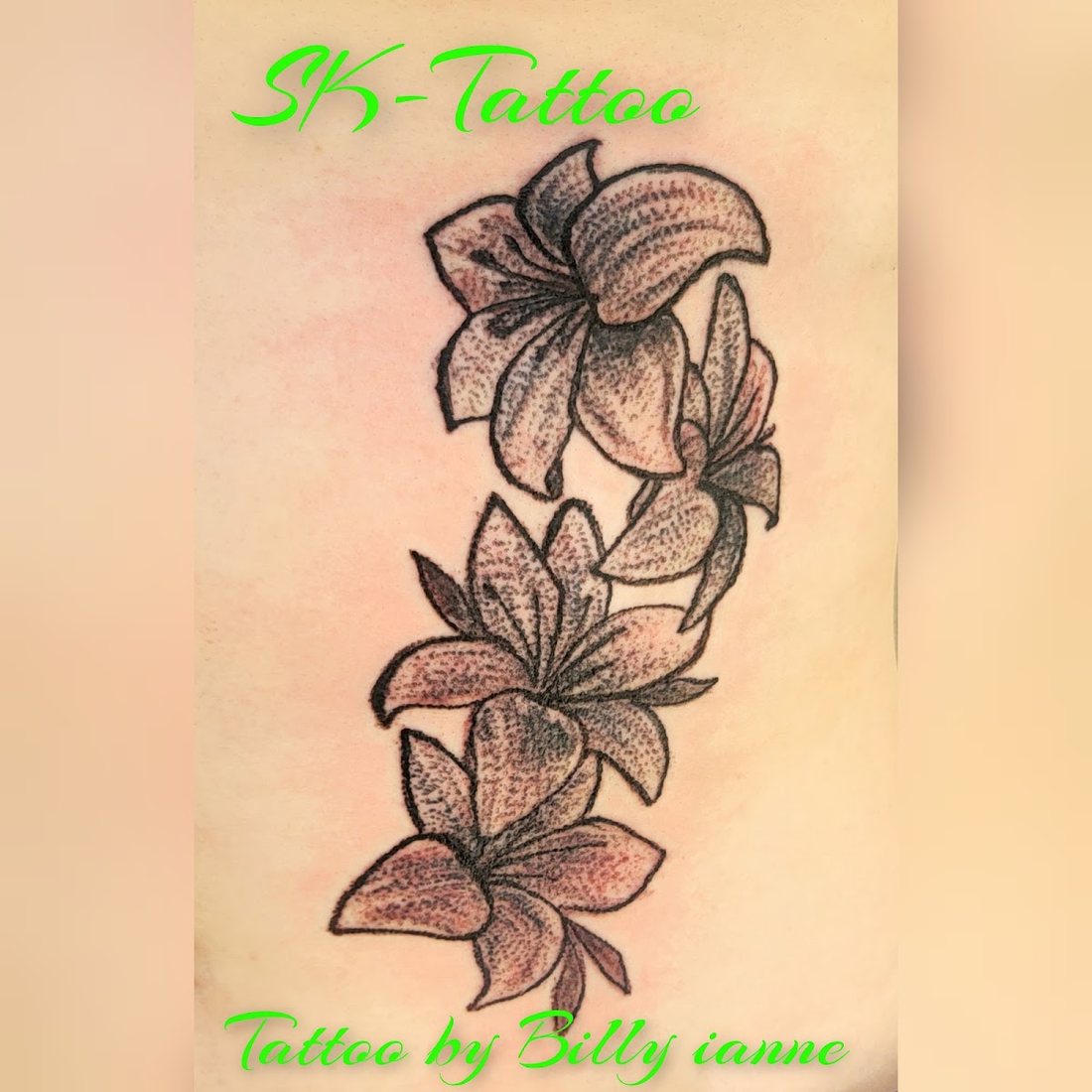 Lilies on the forearm by Billy at SK-Tattoo1 in Meridian, Mississippi
