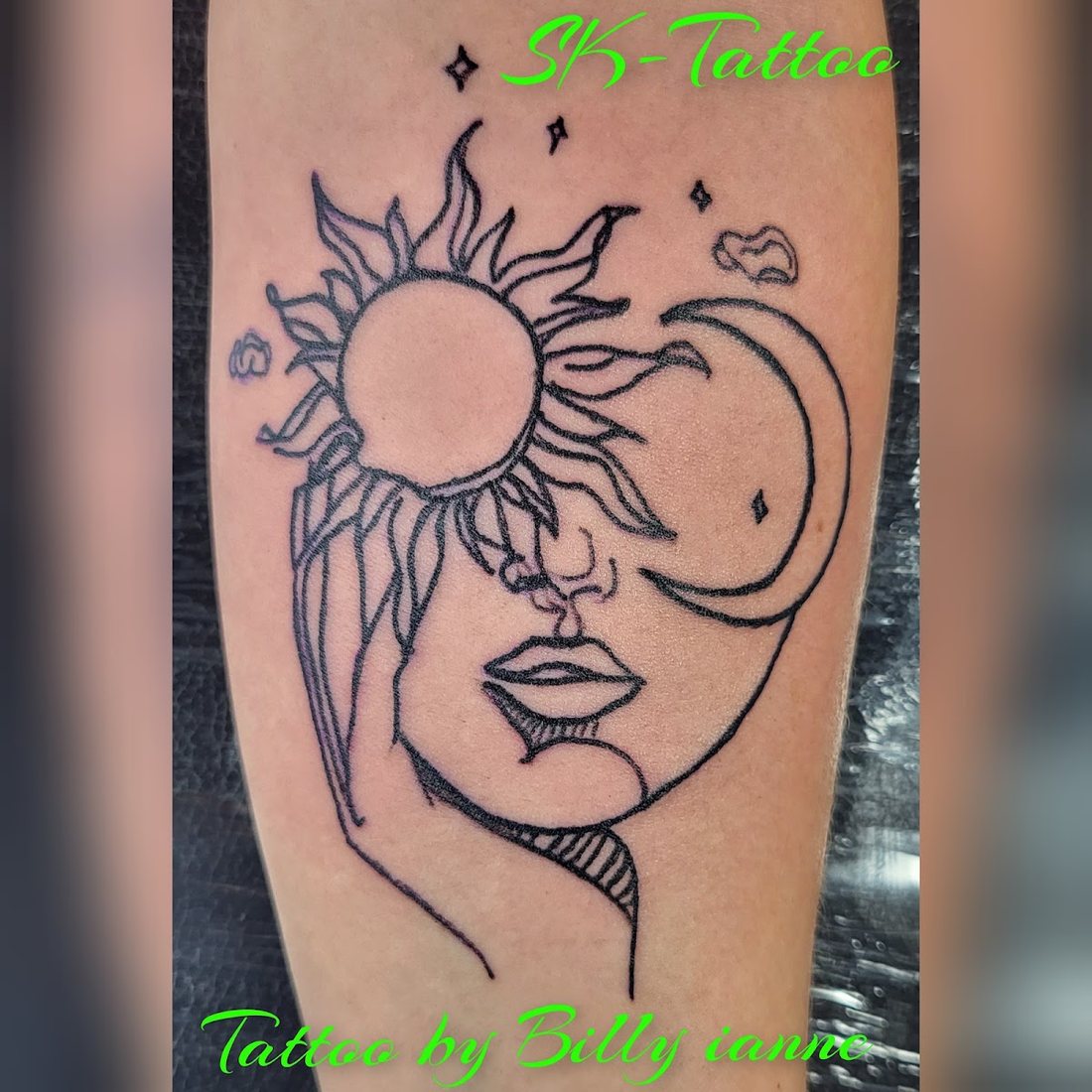 Fine-line sun and moon face by Billy at SK-Tattoo1 in Meridian, Mississippi